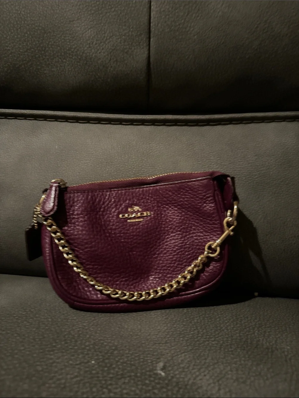 Coach Pebbled wristlet in Plum with Gold Chain